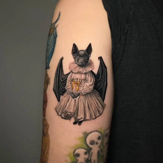 Medium Blackwork Bat in Dress Tattoo on Women Arm by @caiuri.barros