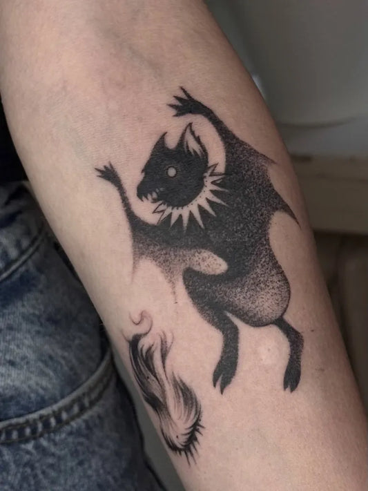 Medium Blackwork Bat with Flames Tattoo on Women Arm by @andrei.urvik