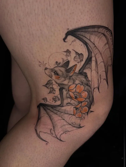 Medium Blackwork Bat with Flowers Tattoo on Women Thigh by @darlington.enchanted