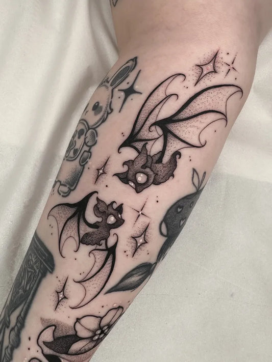 Medium Blackwork Bats and Stars Tattoo on Women Arm by @_leahlopezart_