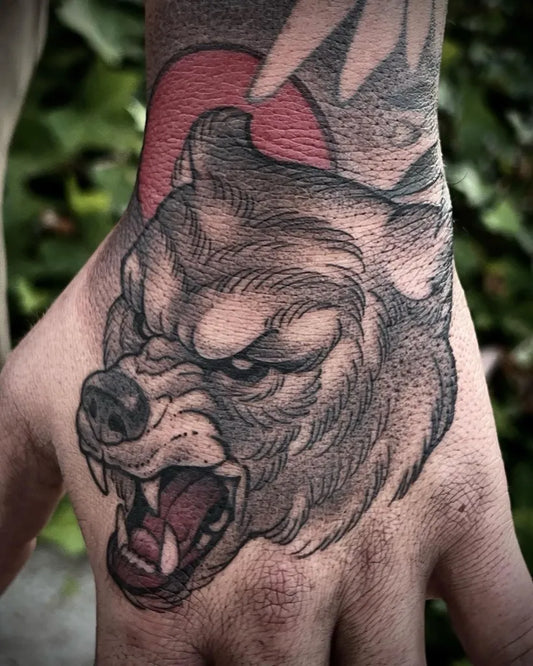 Medium Blackwork Bear on Men Hand Tattoo by @jacobhenrytattoos