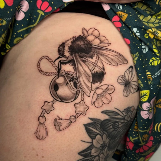 Medium Blackwork Bee Bell Flowers on Women Thigh Tattoo by @skyetattoowa