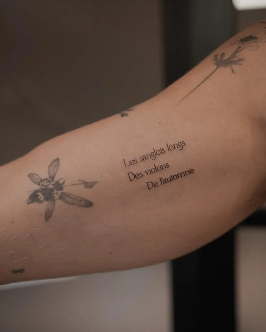 Medium Blackwork Bee Flower Quote Tattoo on Women Arm by @maff.leal