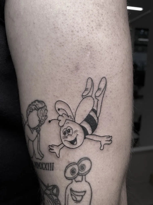 Medium Blackwork Bee and Cartoon Characters on Men Arm Tattoo by @tattoos_by_tali