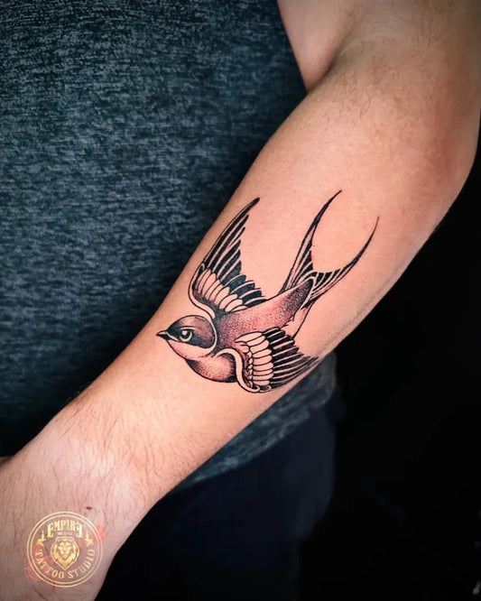 Medium Blackwork Bird Tattoo on Men Arm by @empiretattoostudiosl