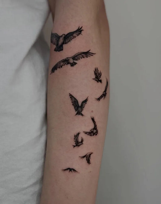 Medium Blackwork Birds Tattoo on Men Arm by @roz.inka_