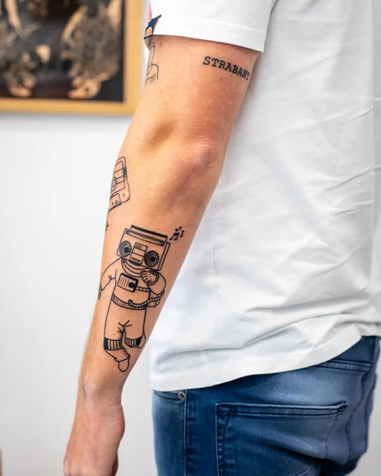 Medium Blackwork Boombox Astronaut Music Tattoo on Men Arm by @annedekkertattoo