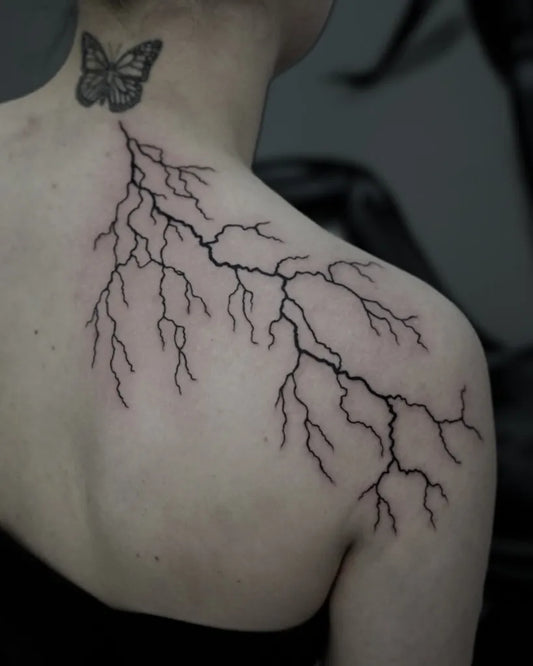 Medium Blackwork Butterfly Lightning Tattoo on Women Shoulder by @ag_blackwork