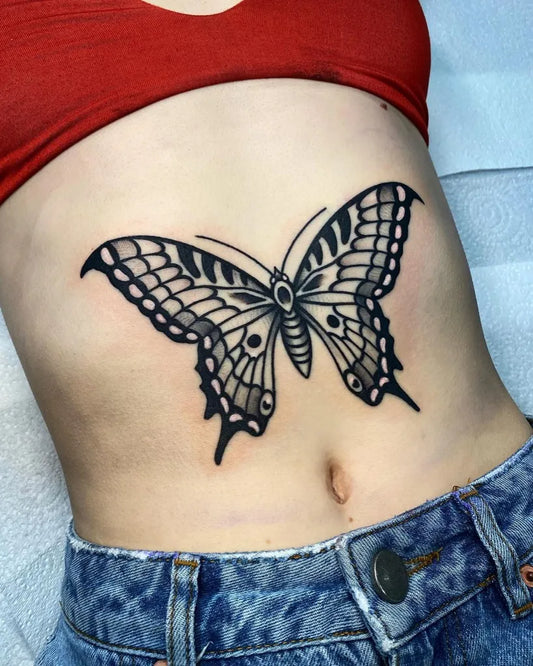 Medium Blackwork Butterfly Tattoo on Women Stomach by @alxgracia