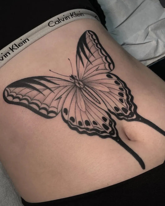 Medium Blackwork Butterfly Tattoo on Women Stomach by @jennyinkz