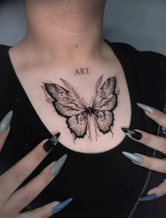 Blackwork Butterfly and Lettering on Women Chest Tattoo by @pintoranonimo.tts