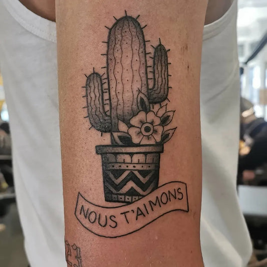 Medium Blackwork Cactus Flower Pot Tattoo on Women Arm by @hilaryrandle