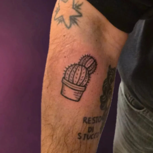 Medium Blackwork Cactus in Pot Tattoo on Men Arm by @solomon.b_