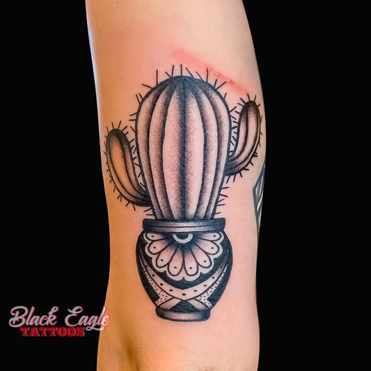 Medium Blackwork Cactus in Pot Tattoo on Women Arm by @blackeagletattoos