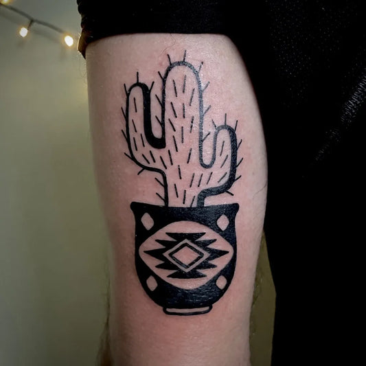Medium Blackwork Cactus in Pot Tattoo on Women Arm by @momokrakentattoo