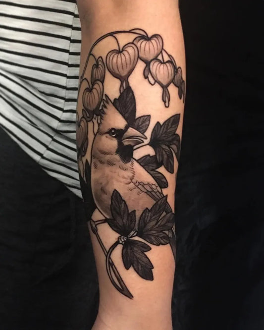 Medium Blackwork Cardinal and Hearts Tattoo on Women Arm by @sanctuarytattoogallery