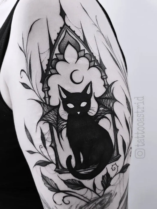 Medium Blackwork Cat Bat Archway Tattoo on Women Shoulder by @tattooastrid