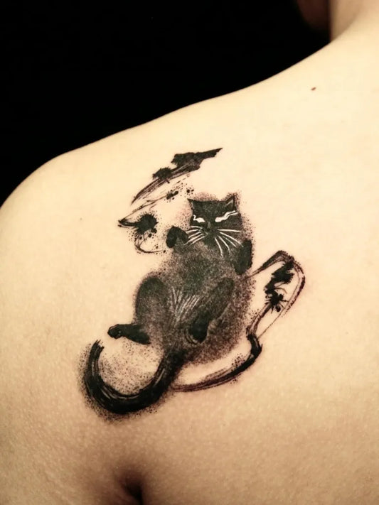 Medium Blackwork Cat and Shoes Tattoo on Women Shoulder by @echo.tattoos
