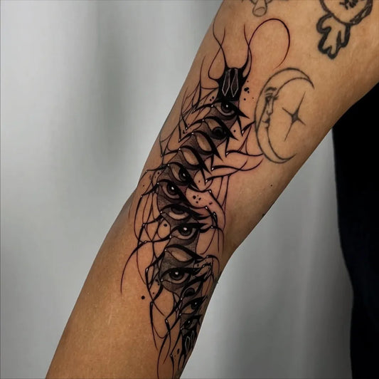 Medium Blackwork Centipede Eyes Moon Tattoo on Men Arm by @xen.inkz
