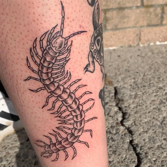Medium Blackwork Centipede Tattoo on Men Arm by @ce.morr.tattoos