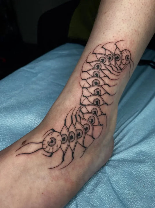 Medium Blackwork Centipede Tattoo on Women Foot by @talkshowhost._
