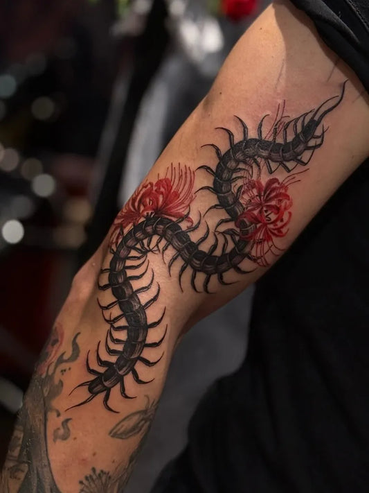 Medium Blackwork Centipede and Spider Lily Tattoo on Men Arm by @brandonjames_art