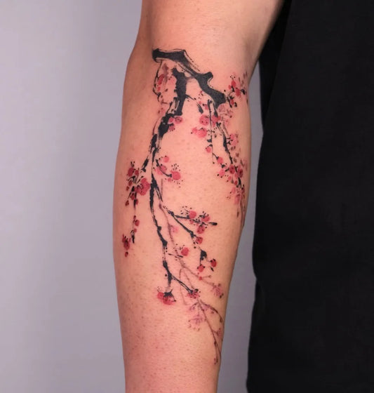 Medium Blackwork Cherry Blossom Branches on Women Arm Tattoo by @maobi.tattoo