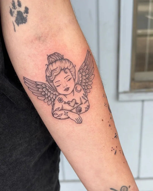 Medium Blackwork Cherub Tattoo on Women Arm by @gracehardytattoos