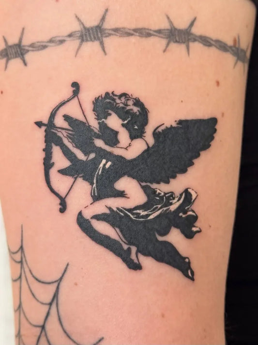 Medium Blackwork Cherub Tattoo on Women Arm by @hacktatts