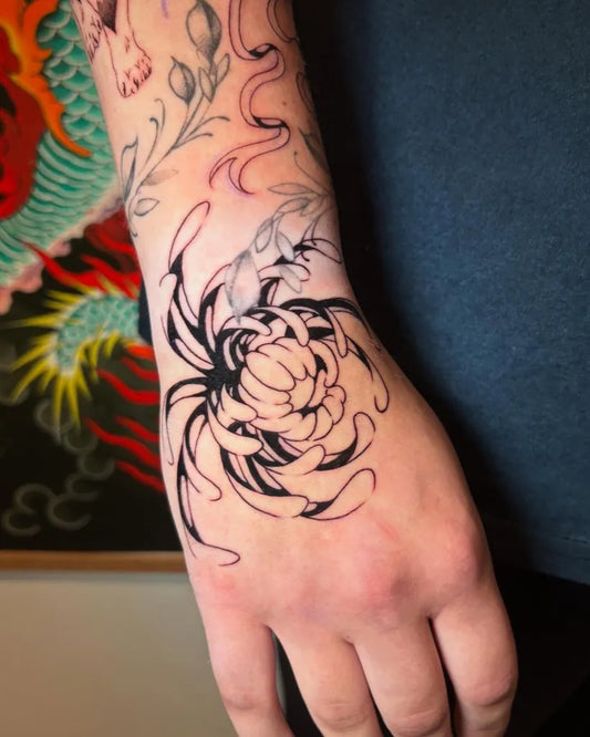 Medium Blackwork Chrysanthemum Black Tattoo on Women Wrist by @elliediamondtattoos
