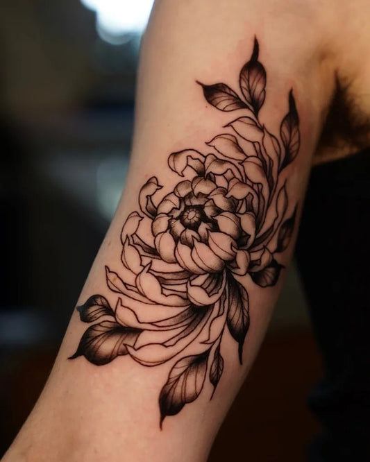 Medium Blackwork Chrysanthemum Leaves Tattoo on Women Arm by @tifflai.tattoos