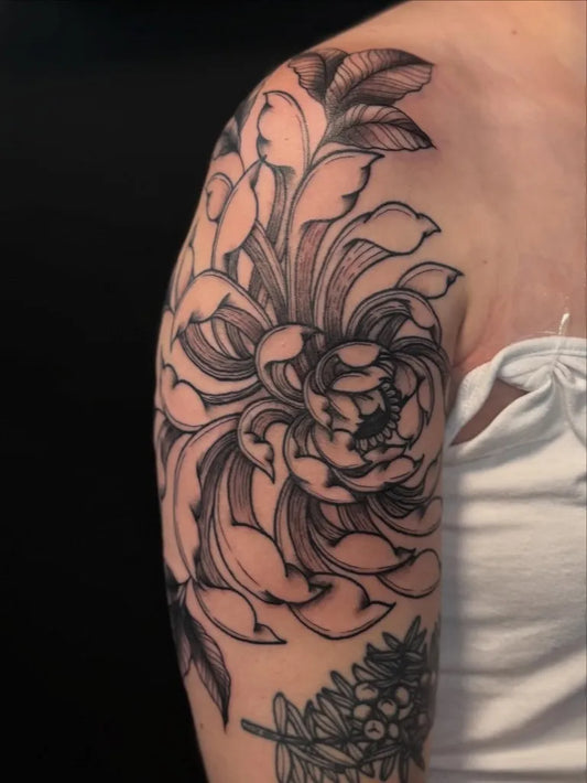 Medium Blackwork Chrysanthemum Leaves Tattoo on Women Shoulder by @tattoosbykaylin_