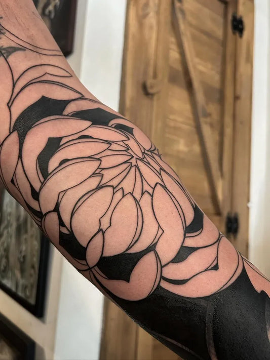 Medium Blackwork Chrysanthemum Tattoo on Men Arm by @danidtattooer