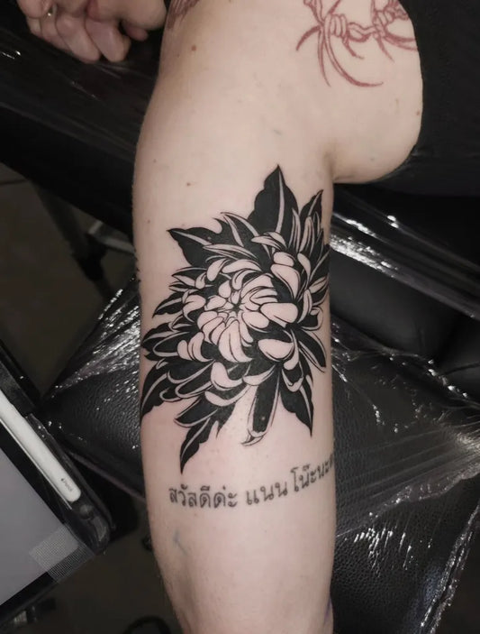 Medium Blackwork Chrysanthemum Tattoo on Women Arm by @garokim_tattoo