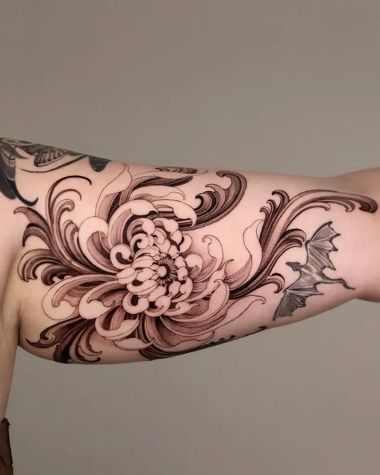 Medium Blackwork Chrysanthemum and Bat Tattoo on Women Arm by @gush.like.kush