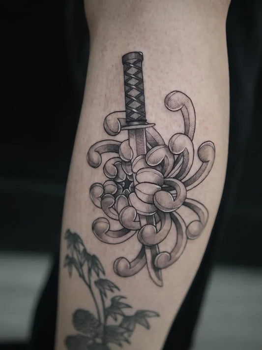 Medium Blackwork Chrysanthemum and Sword Tattoo on Women Thigh by @_letattoo