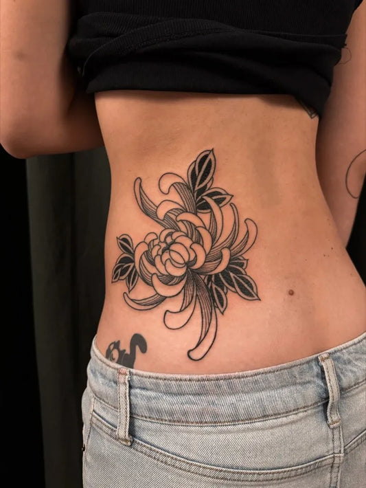 Medium Blackwork Chrysanthemum black Tattoo on Women Back by @unbound.ink