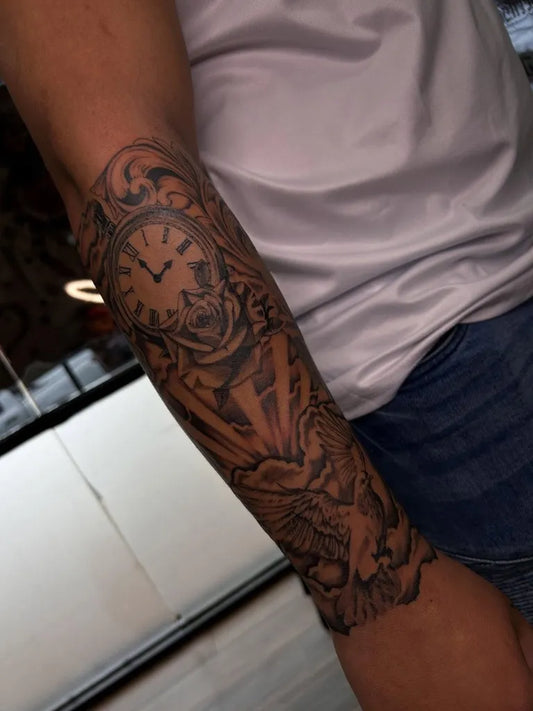 Medium Blackwork Clock Dove Tattoo on Men Arm by @artbymiah_