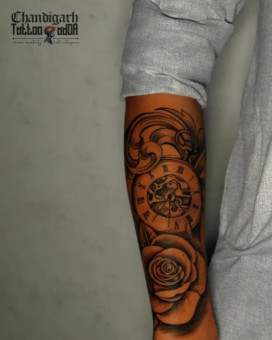 Medium Blackwork Clock Rose Tattoo on Men Arm by @chandigarhtattooadda