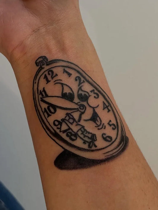 Medium Blackwork Clock Tattoo on Men Wrist by @goatheadstudio