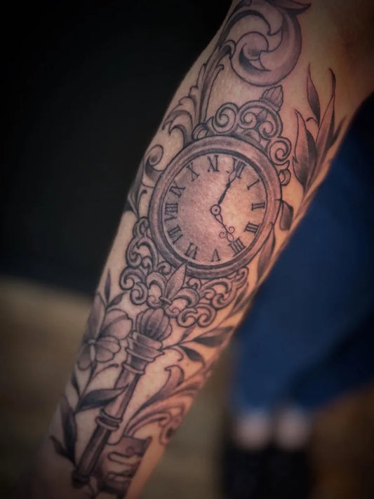 Medium Blackwork Clock and Key Tattoo on Women Arm by @justinstattoos