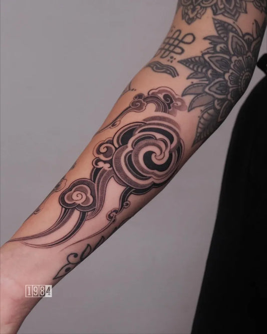 Medium Blackwork Cloud Tattoo on Women Arm by @1984.studios