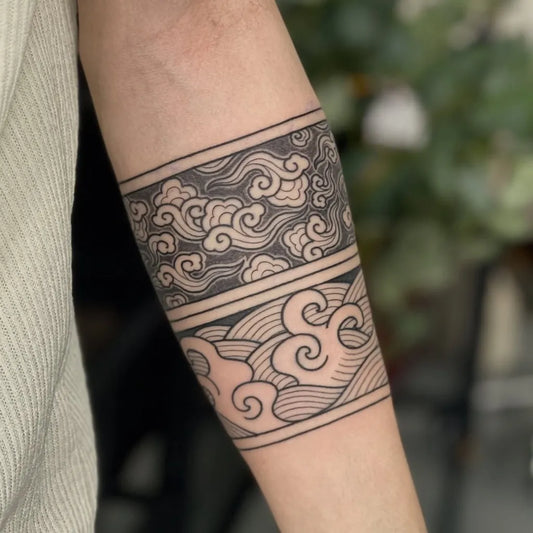 Medium Blackwork Cloud Waves Tattoo on Men Arm by @ngaiiijun