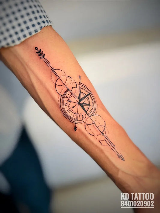 Medium Blackwork Compass Arrow Tattoo on Men Arm by @kd_tattoo_saloon