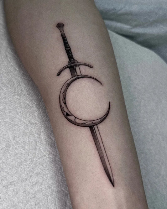 Medium Blackwork Crescent Moon Sword Tattoo on Women Forearm by @nuffink_