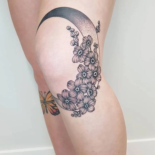 Medium Blackwork Crescent Moon and Flowers Tattoo on Women Thigh by @kyrangtattoo