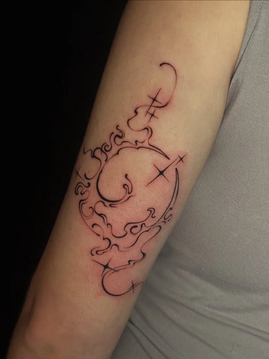 Medium Blackwork Crescent Moon and Swirls Tattoo on Women Arm by @myjinju.tattoo