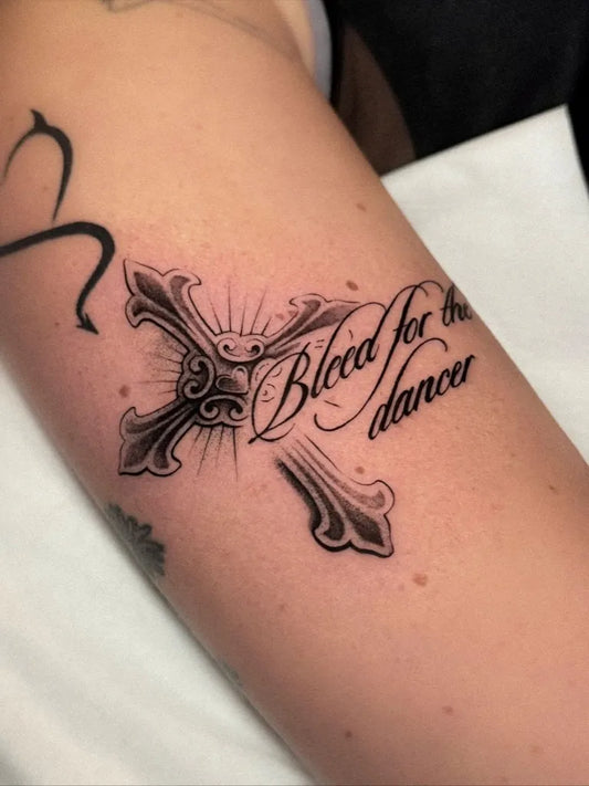 Medium Blackwork Cross Blood for the Dancer on Women Arm Tattoo by @jesscat.tattoo