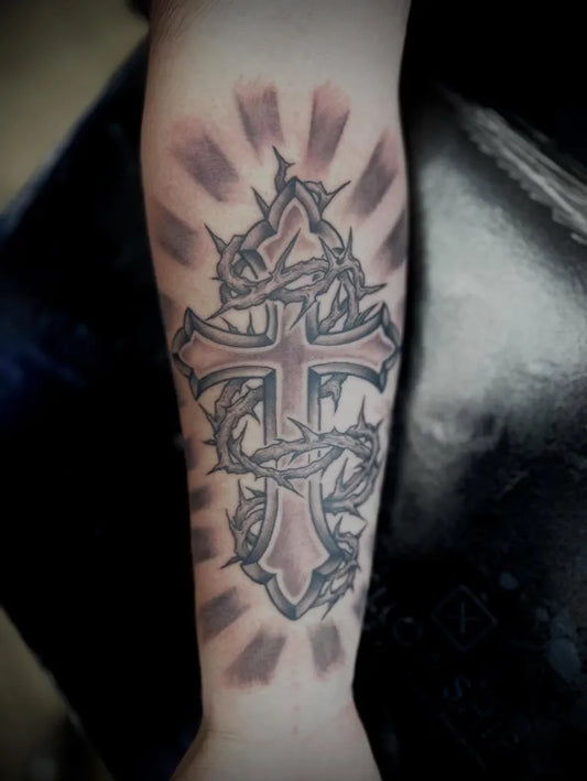 Medium Blackwork Cross with Barbed Wire on Men Arm Tattoo by @pensacolatattoostudio