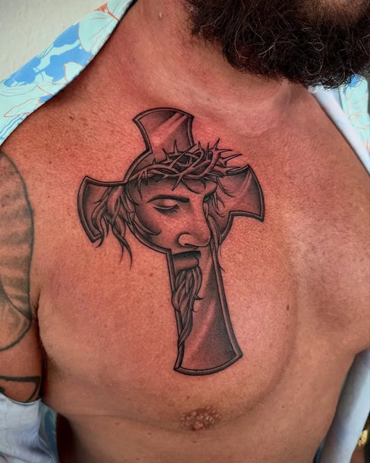 Medium Blackwork Cross with Jesus Face on Men Chest Tattoo by @chubstattoos